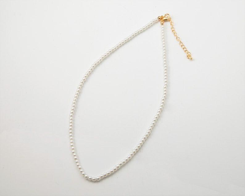 Pearl necklace finished in Gold